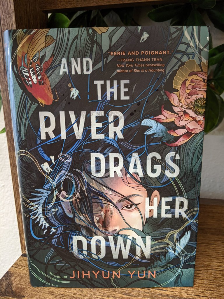 And the River Drags Her Down