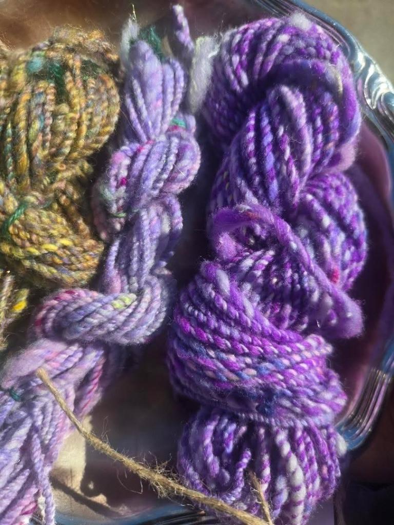 Small skeins of yarn in different colors