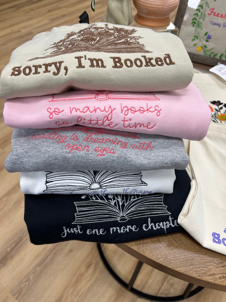 Simply Stylish Stitches display embroidered sweatshirts