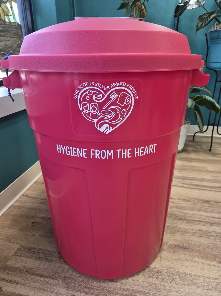 Red bin labeled Hygiene from the Heart